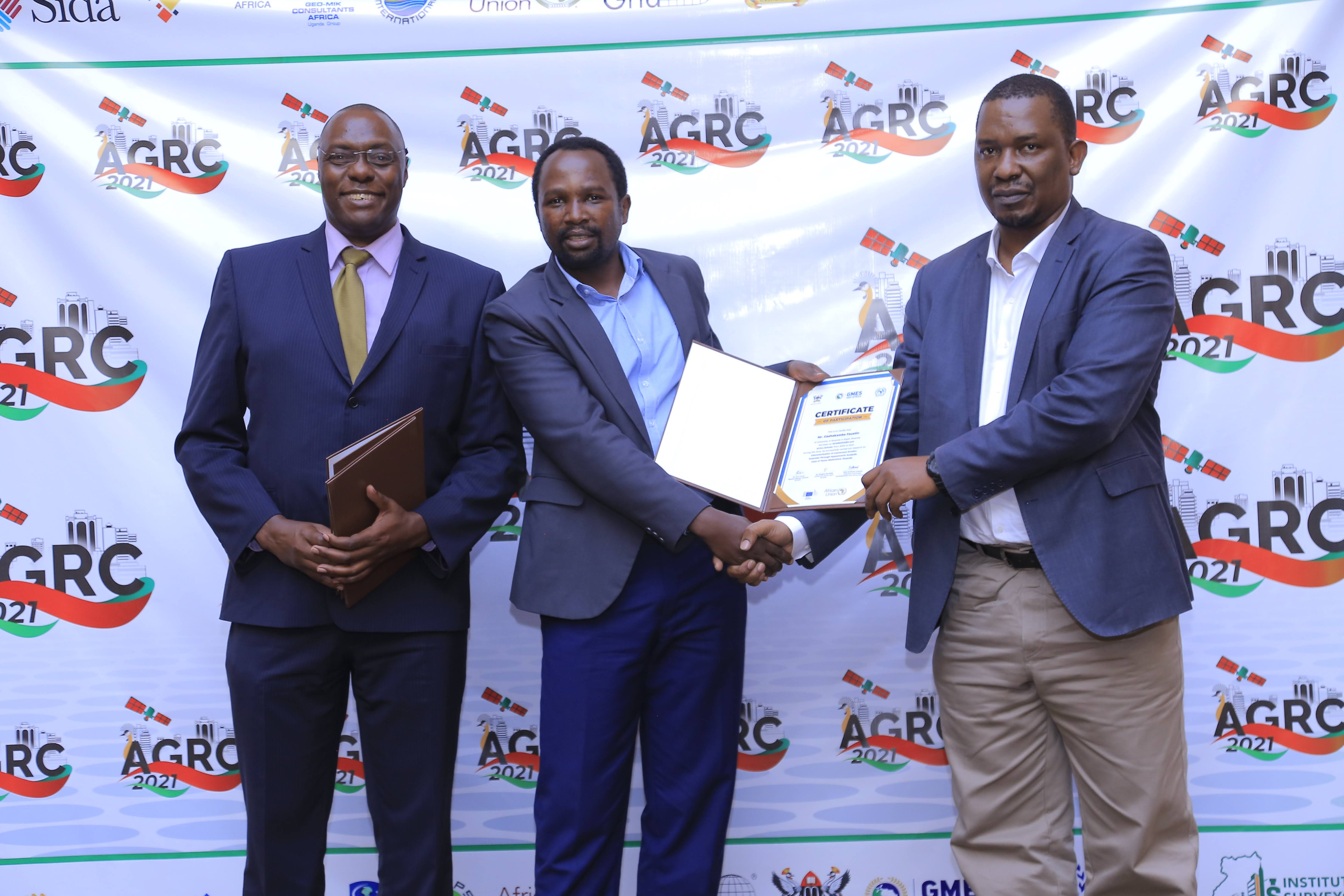 Faustin Gashakamba receiving a certificate at a professional event